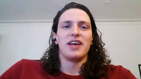 Controversial college swim star beaten by fellow transgender athlete